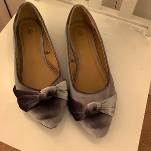 Grey/silver velvet flats with bows.